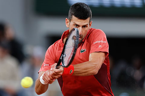 Djokovic plays a shot against Roberto Carballes Baena 